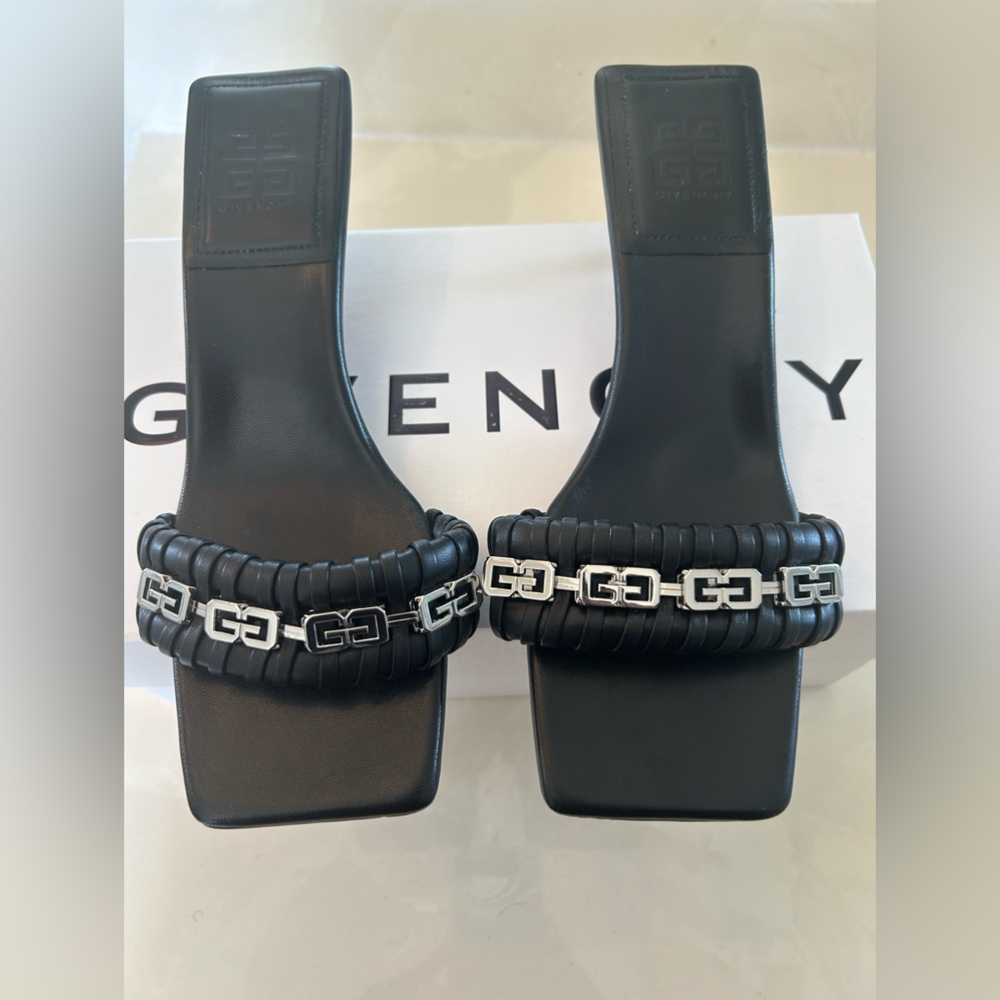 I am selling a pair of Givenchy authentic black kitten heel sandals in a size 41